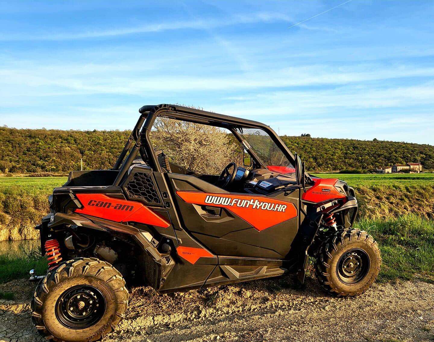 ATV quad riders on a trail through the Istrian countryside